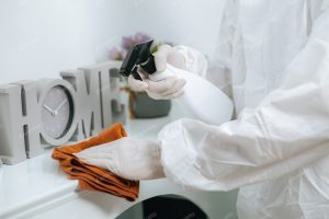Disinfection specialist in PPE suit performing public decontamination Stock Photo, ft. apartment & business - Envato