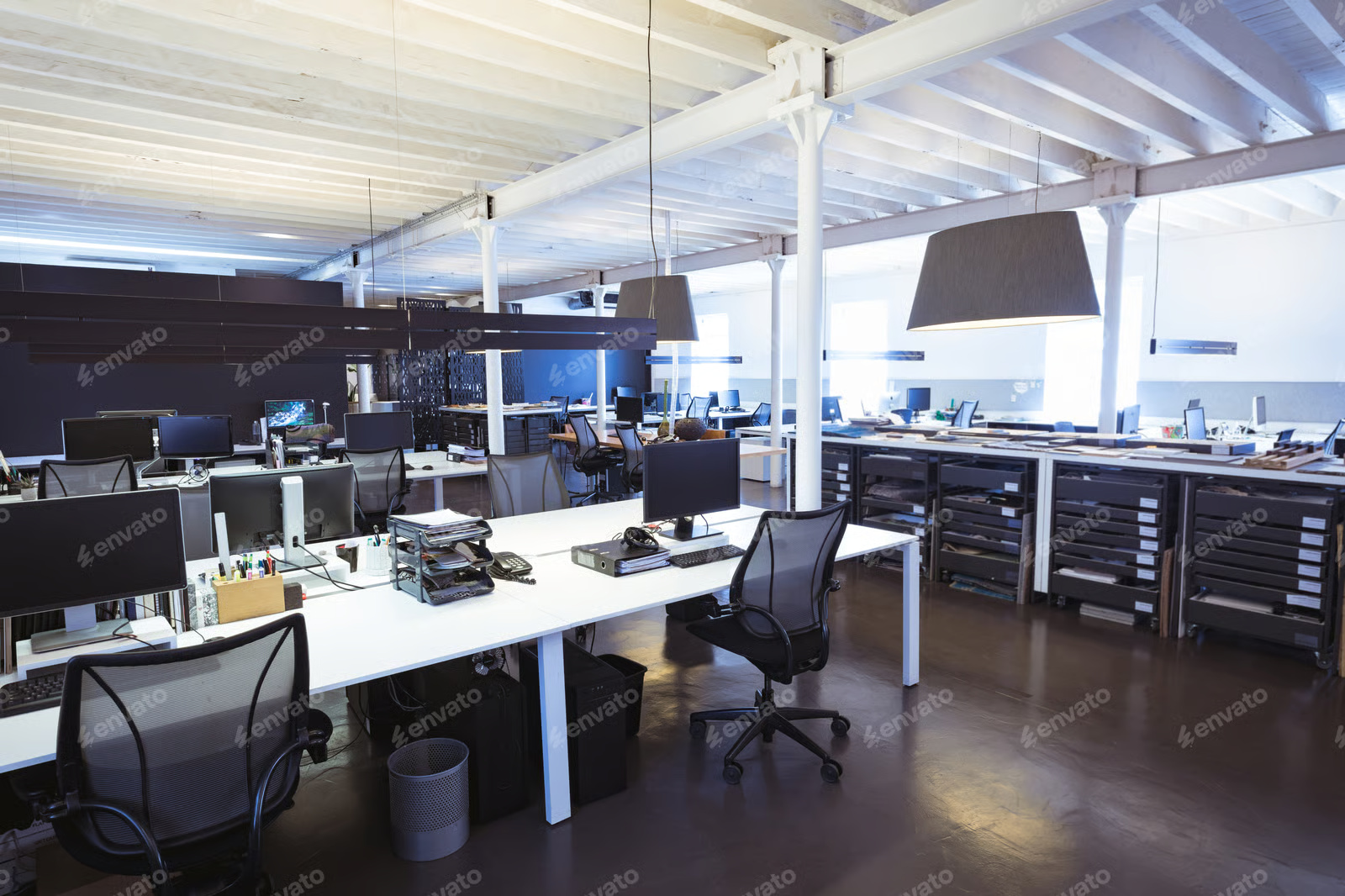 Empty swivel chairs with computers at desks in illuminated modern office Stock Photo, ft. absence & business
